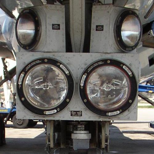 Image of nose gear landing lights, showing turnoff lights positioned above nose gear landing lights.
