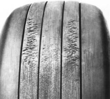 Tread damage caused by running and/or braking on cross-grooved runways.