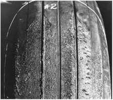 An oval-shaped area in the tread similar to a skid, but where rubber shows burning due to hydroplaning during landing usually caused by wet or ice-covered runways.